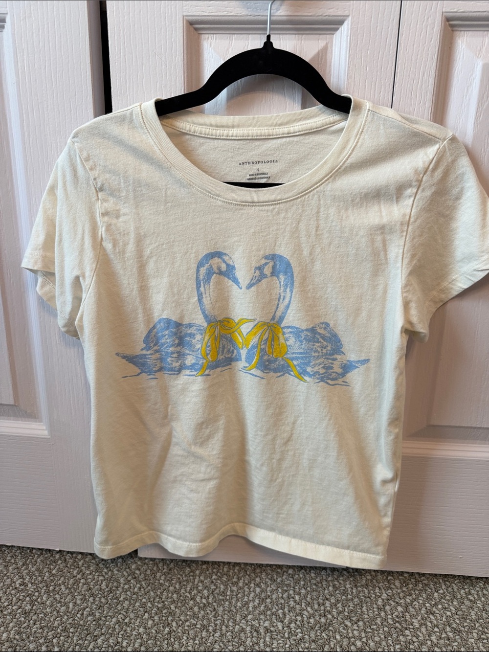 Anthropologie Cream Tee with Blue Swan Graphic and Yellow Bows